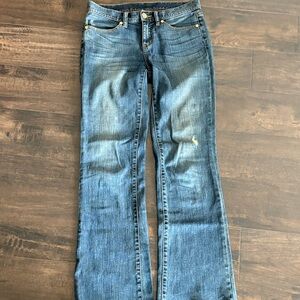 Tory Burch boots cut denim jeans